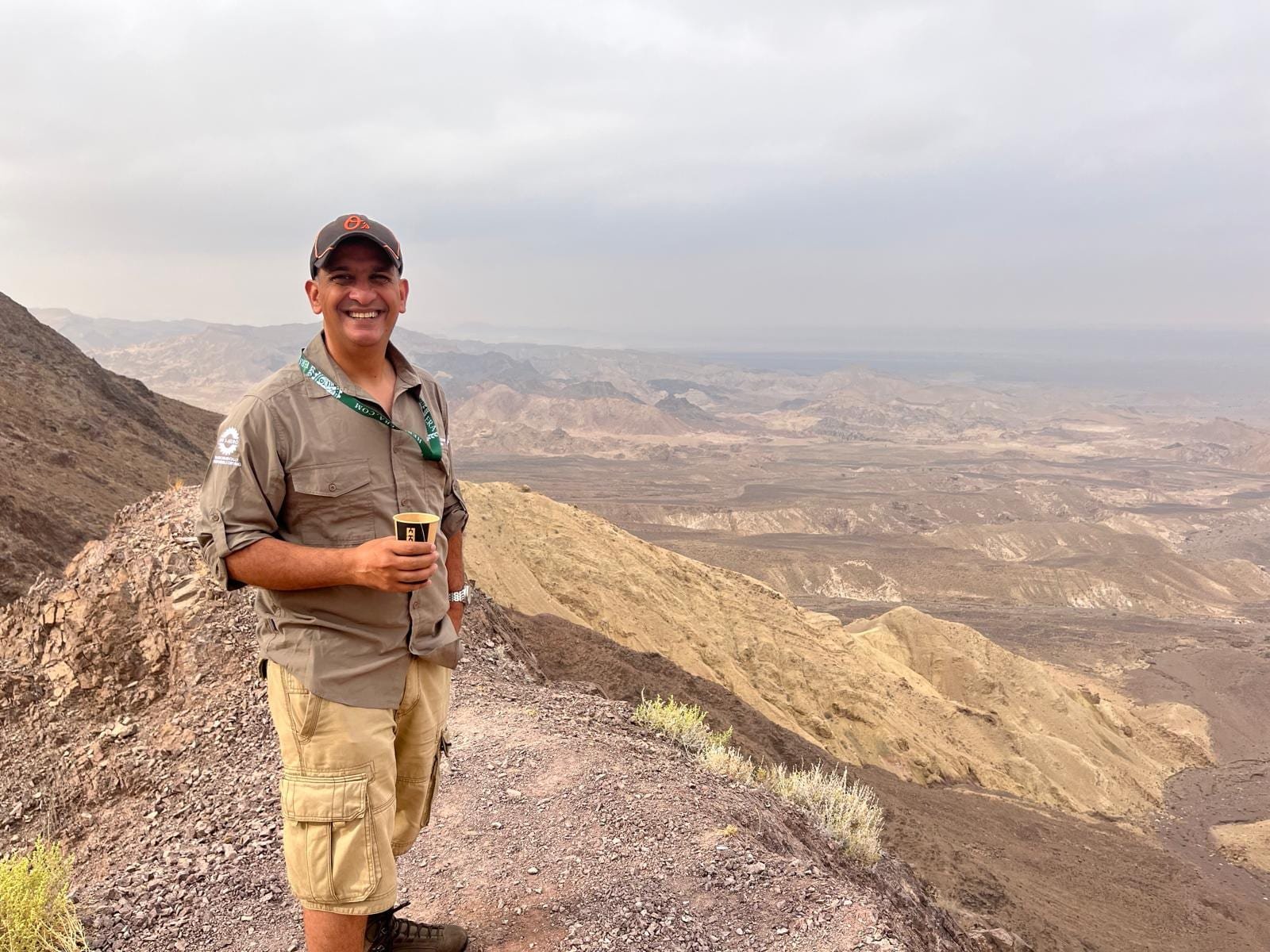 Professor Khan on a desert ridge during expedition medical cover